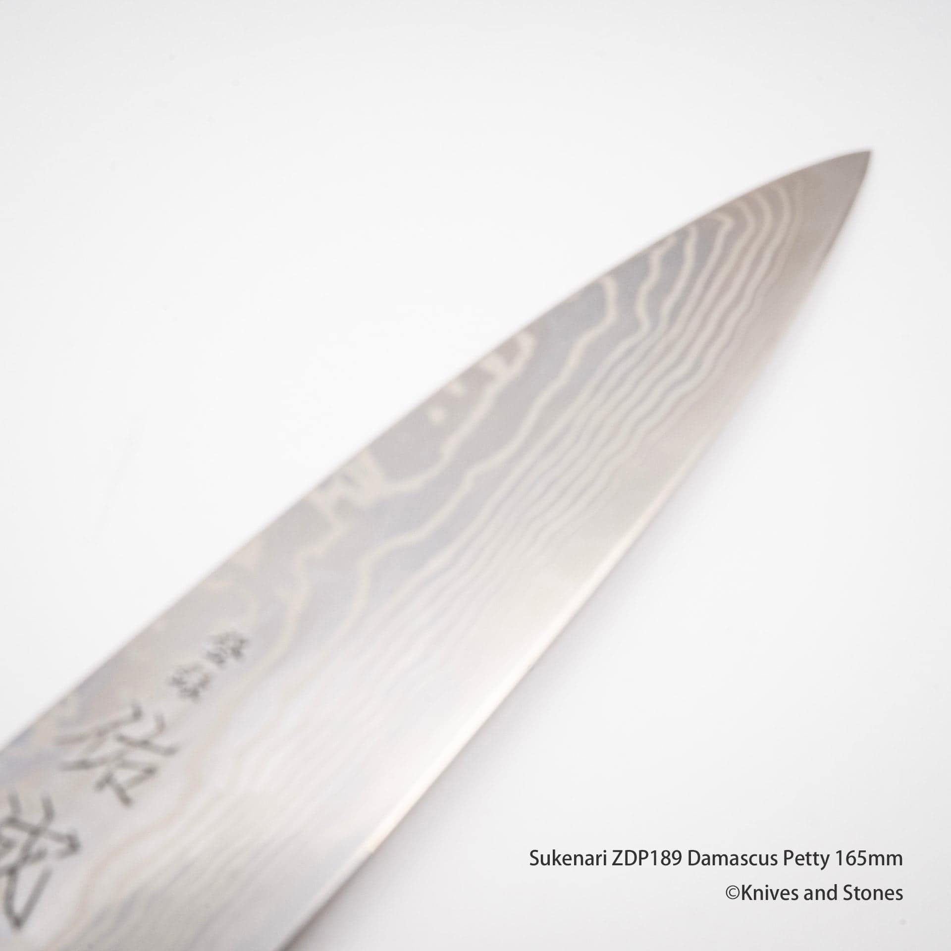 SukenariZDP189DamascusPetty165mmI.jpg Sukenari ZDP189 Damascus Petty 165mm, view 3