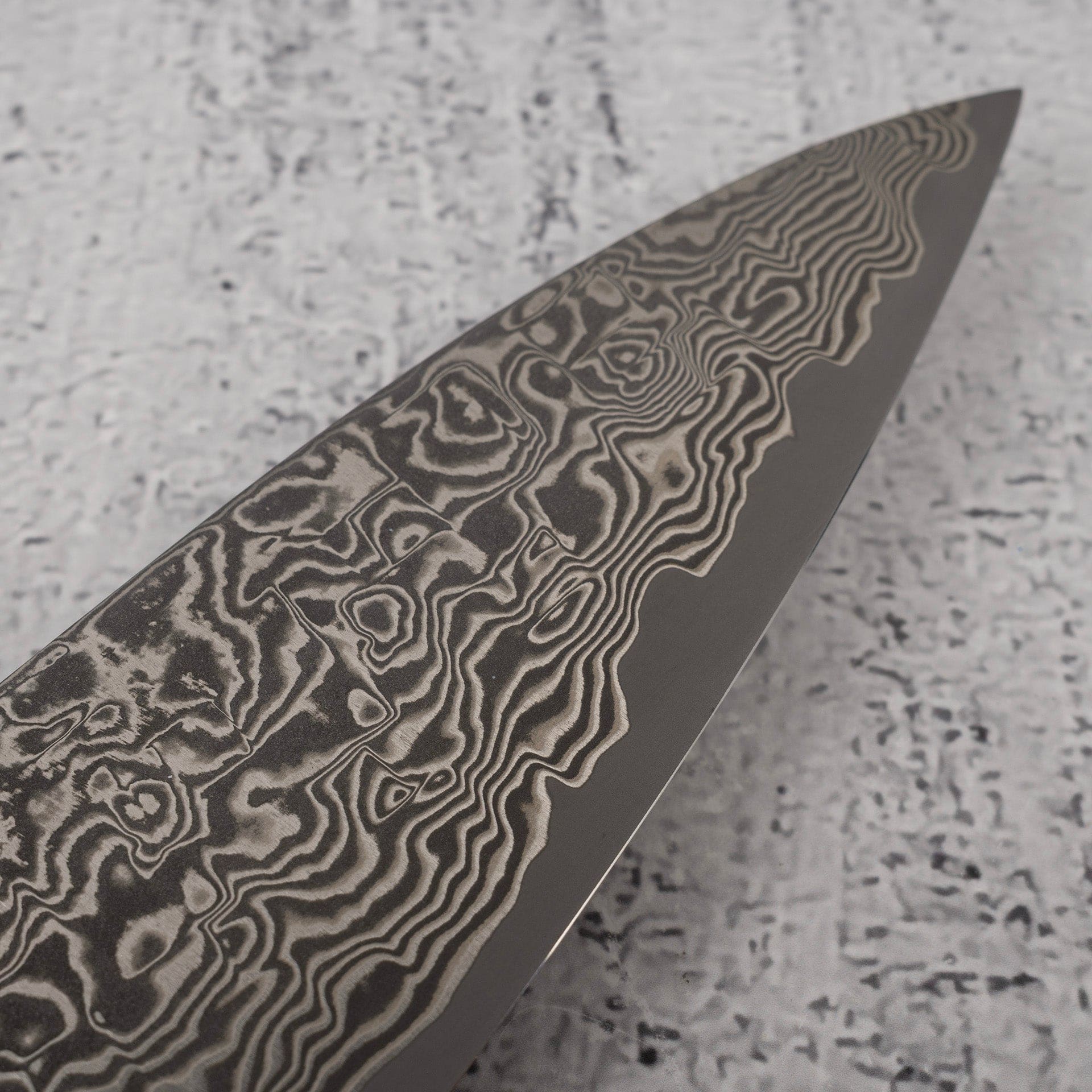 TakeshiSajiSG2BlackDamascusGyuto180mmHeart-shapedIronwoodHandlee.jpg Takeshi Saji SG2 Black Damascus Gyuto 180mm Heart-shaped Ironwood Handle, view 5