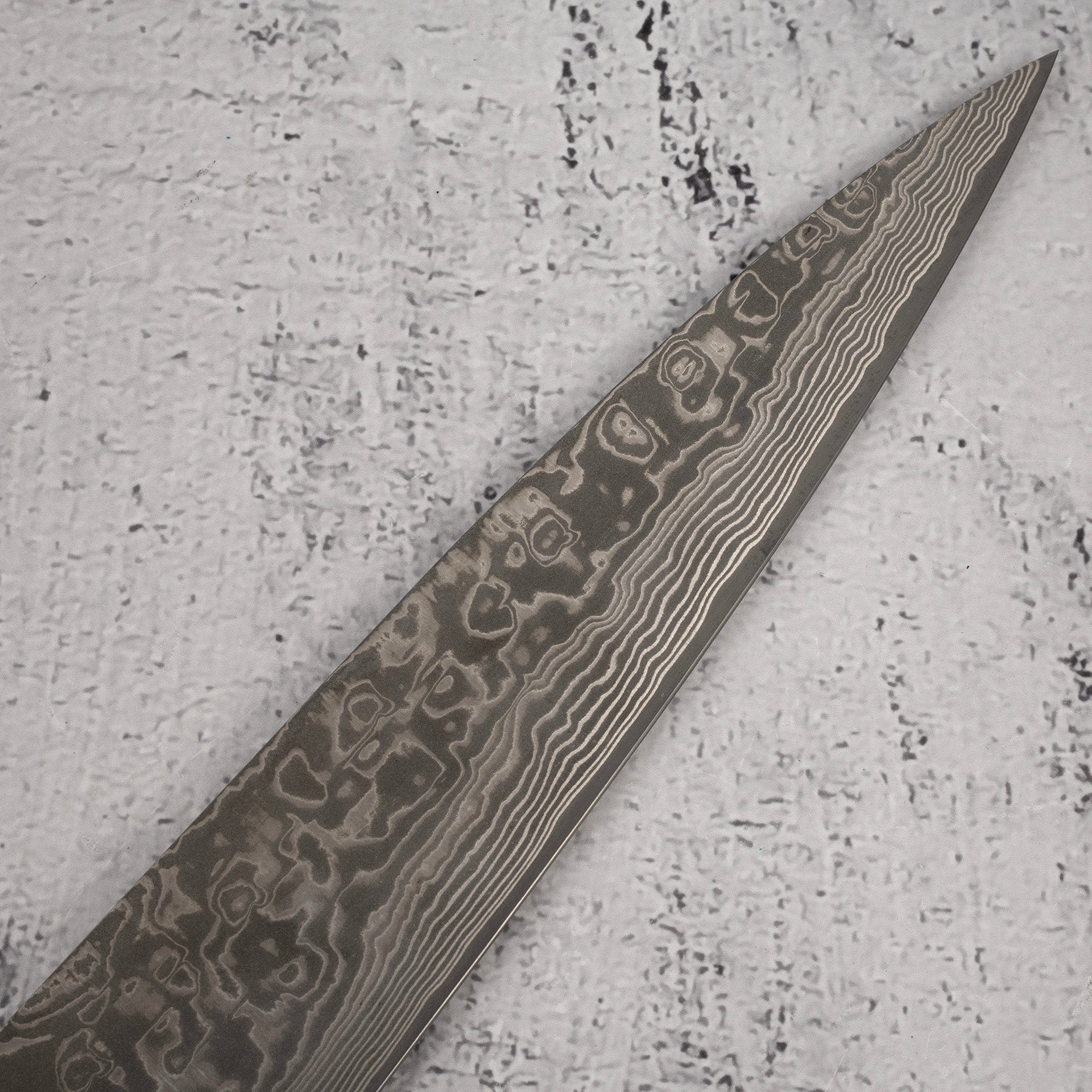 TakeshiSajiSG2BlackDamascusSujihiki240mmHeart-shapedIronwoodHandled_d67fe57d-fe36-47a7-a2d4-434a6086e3a0.jpg Takeshi Saji SG2 Black Damascus Sujihiki 240mm Heart-shaped Ironwood Handle, view 5